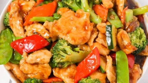 Chicken and mixed vegetable stir fry served in a colorful dish